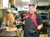 Matt cleaning grease for his pizza delivery side job to pay for machines, 2009